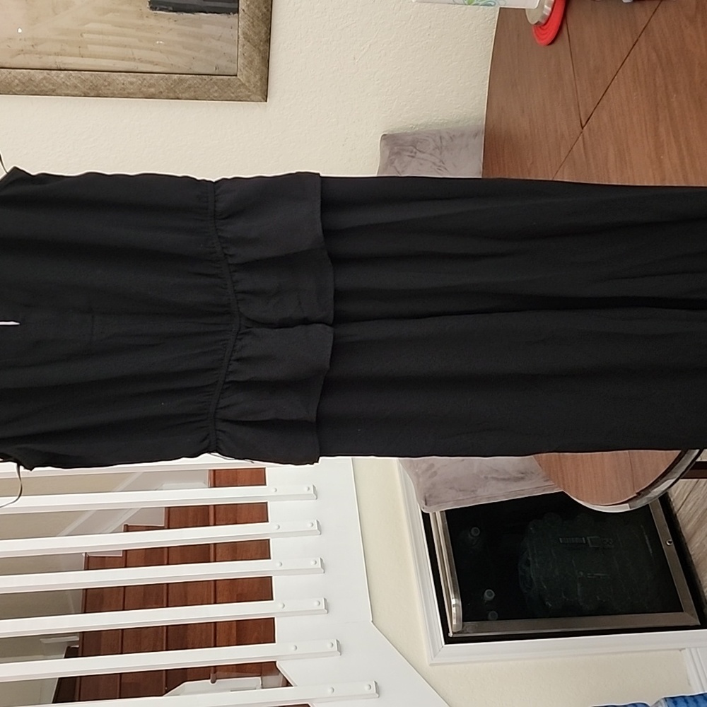 Sleeveless jumpsuit, peekaboo boo front, and back slit on top.